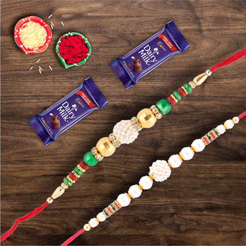 Pair Of Beautiful Pearl Rakhis With Dairymilk Chocolate